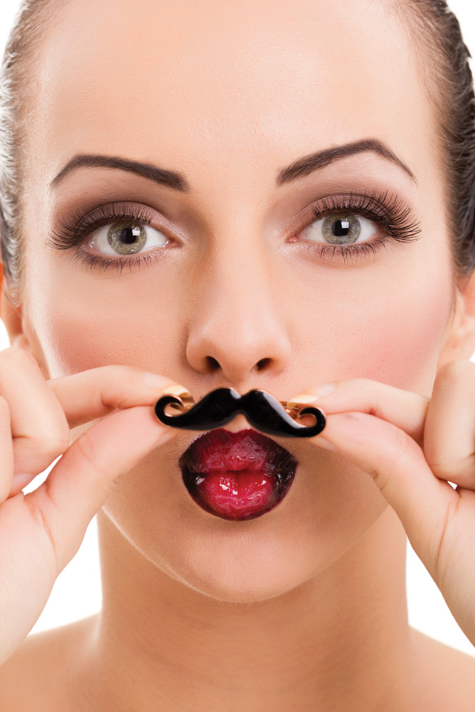beautiful girl with perfect skin holding fake mustache - Photo, Image