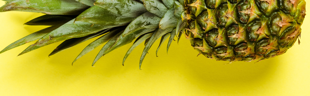 top view of ripe pineapple on yellow background, panoramic shot - Photo, Image