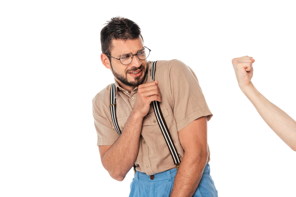 Man showing fist to scared nerd isolated on white - Photo, Image