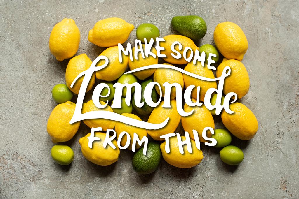 Gri beton yüzeyde renkli avokado, limon ve limon manzarası, bu resimden biraz limonata yap. - Fotoğraf, Görsel