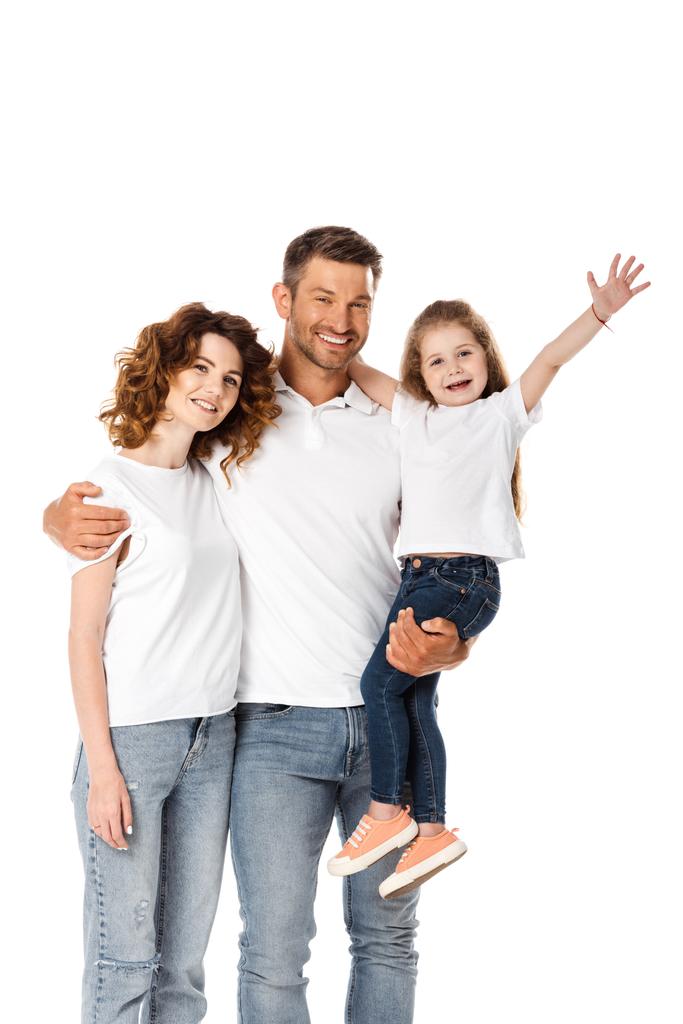 Ευτυχισμένος πατέρας κρατώντας στην αγκαλιά χαριτωμένο κόρη και αγκαλιάζει σγουρά γυναίκα απομονωμένη σε λευκό - Φωτογραφία, εικόνα