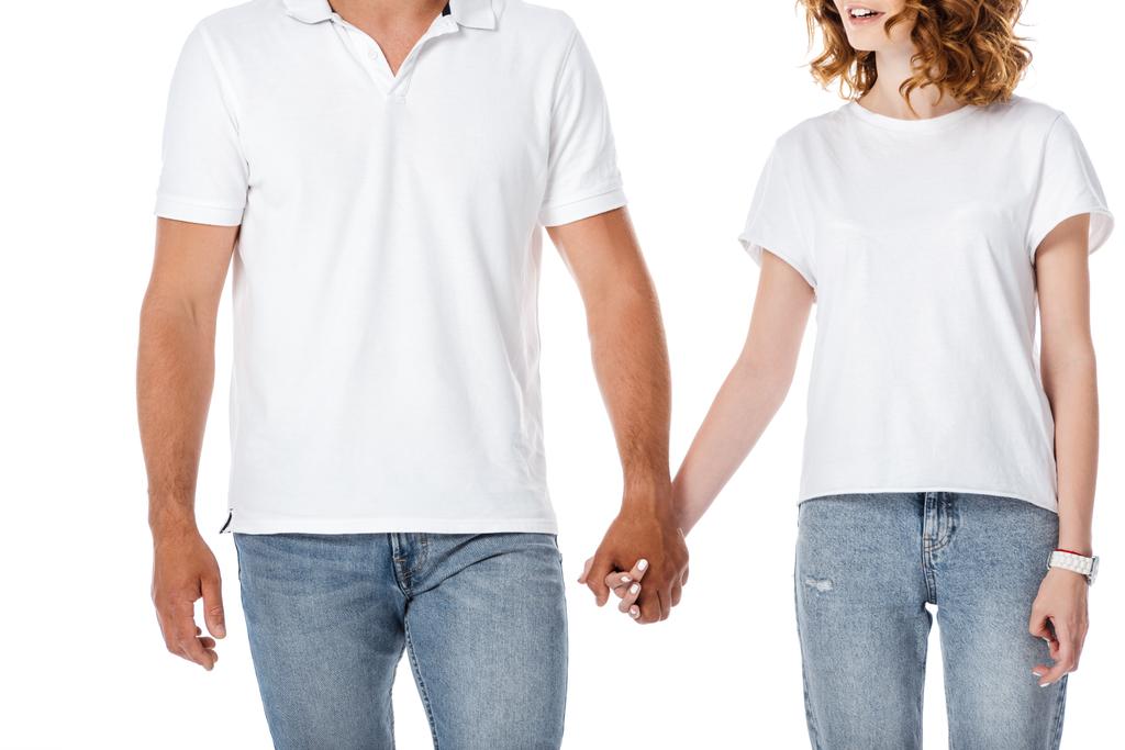 vista ritagliata di uomo e donna tenendo le mani isolate su bianco  - Foto, immagini