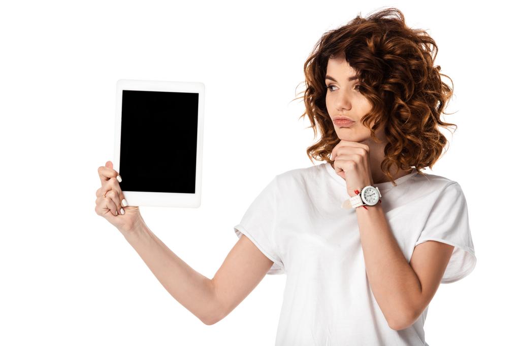 pensive woman holding digital tablet with blank screen isolated on white  - Photo, Image