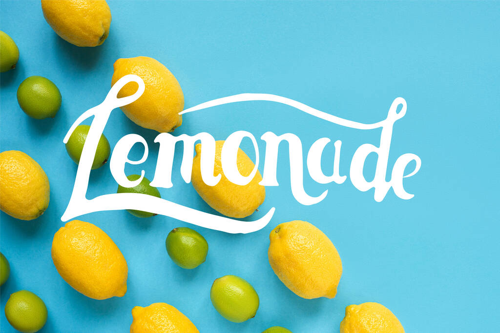 flat lay with ripe yellow lemons, green limes on blue background, lemonade illustration - Photo, Image