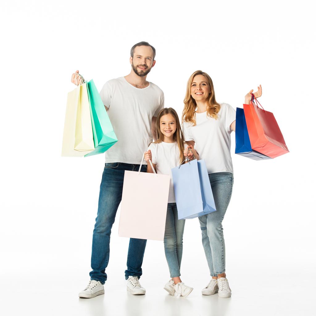 cheerful family with colorful shopping bags isolated on white - Photo, Image