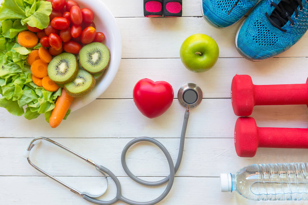 Health Care.  Fresh vegetable salad and green apple with medical stethoscope for diet and weight loss for healthy care and protect virus,  white wooden background.  Copy space and banner for text.  Healthy Life ConceptHealth Care.  Fresh vegetable sa - Photo, Image