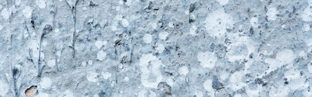 ruw abstract grijs betonnen getextureerd oppervlak, panoramische oriëntatie - Foto, afbeelding