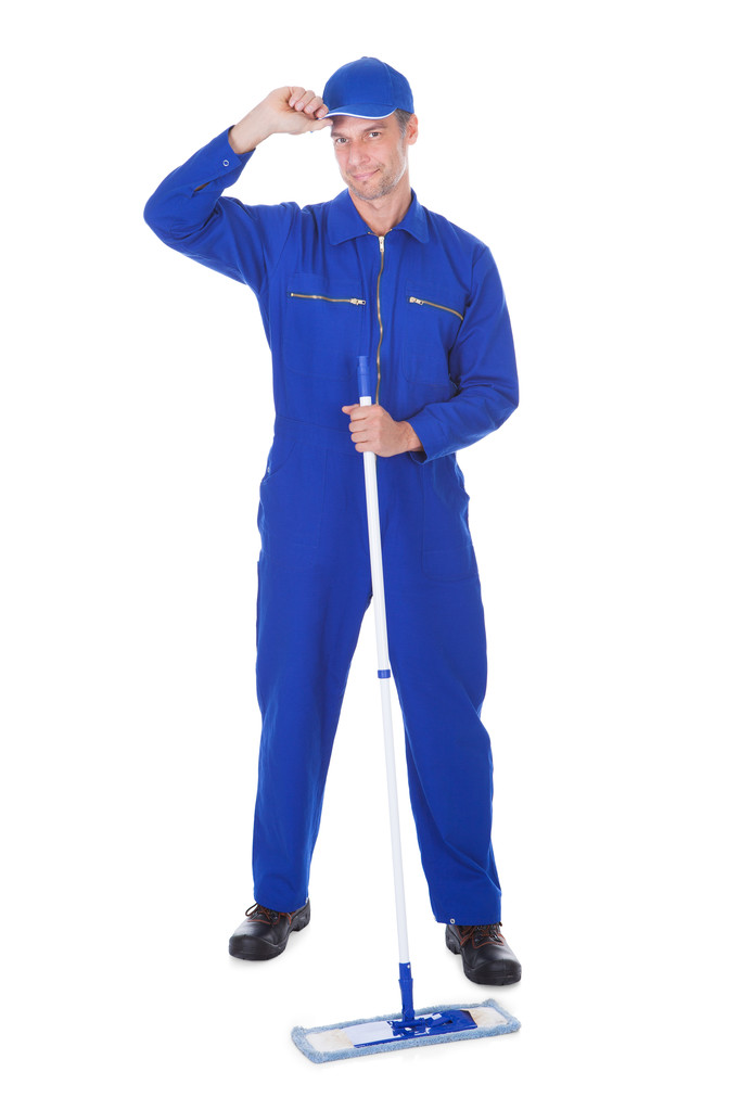 Trabajador en traje de caldera piso de limpieza
 - Foto, Imagen