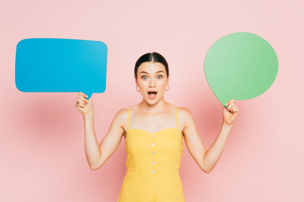 shocked brunette young woman with blank speech bubbles on pink - Photo, Image