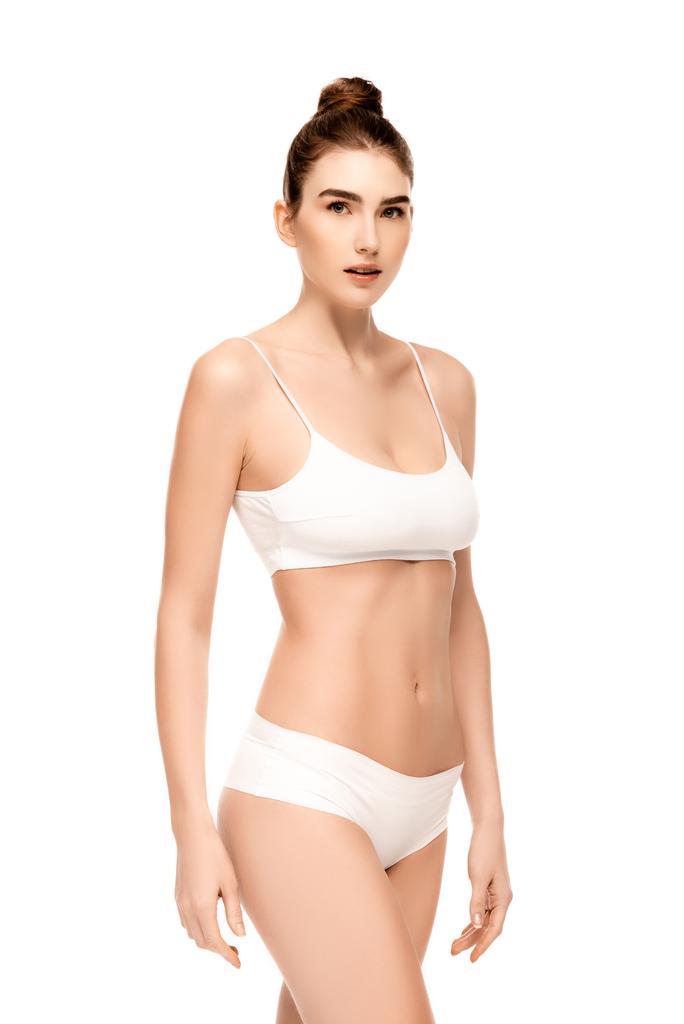 femme avec un corps parfait en culotte et haut debout isolé sur blanc - Photo, image