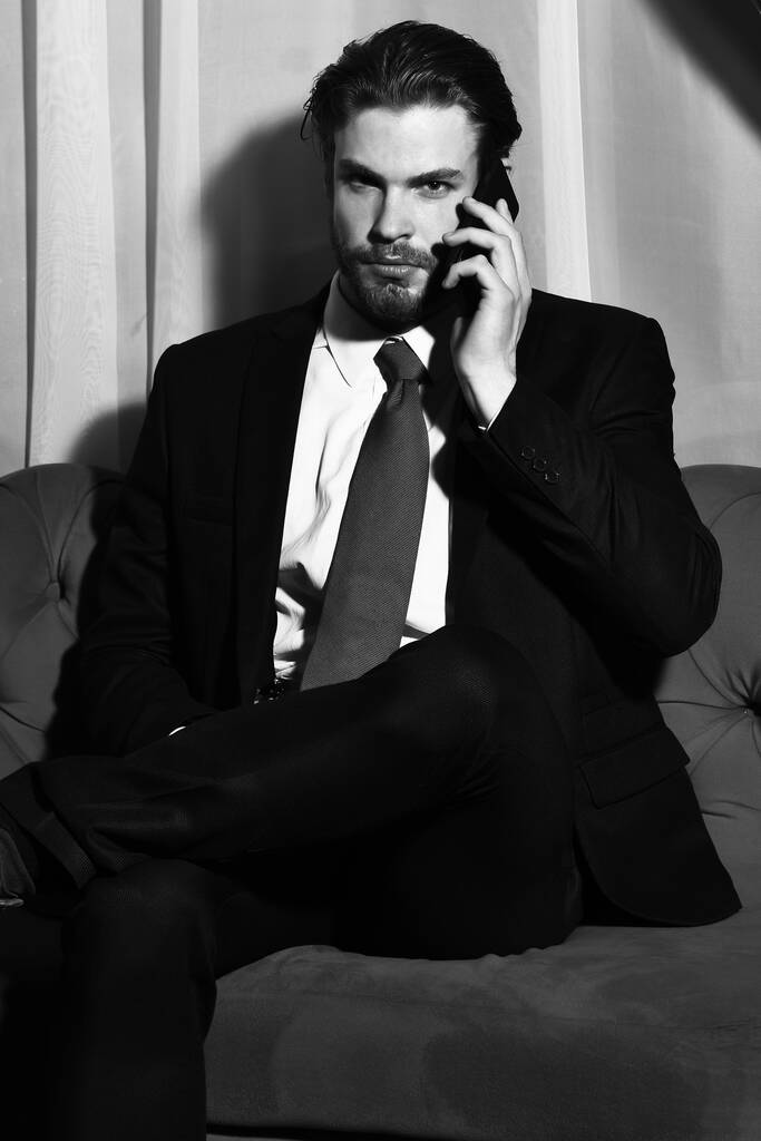 bearded man, businessman speaking on cell phone with red tie - Photo, Image