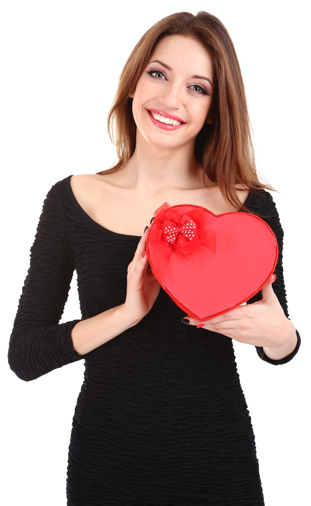 Mulher atraente com caixa de presente em forma de coração, isolado em branco
 - Foto, Imagem