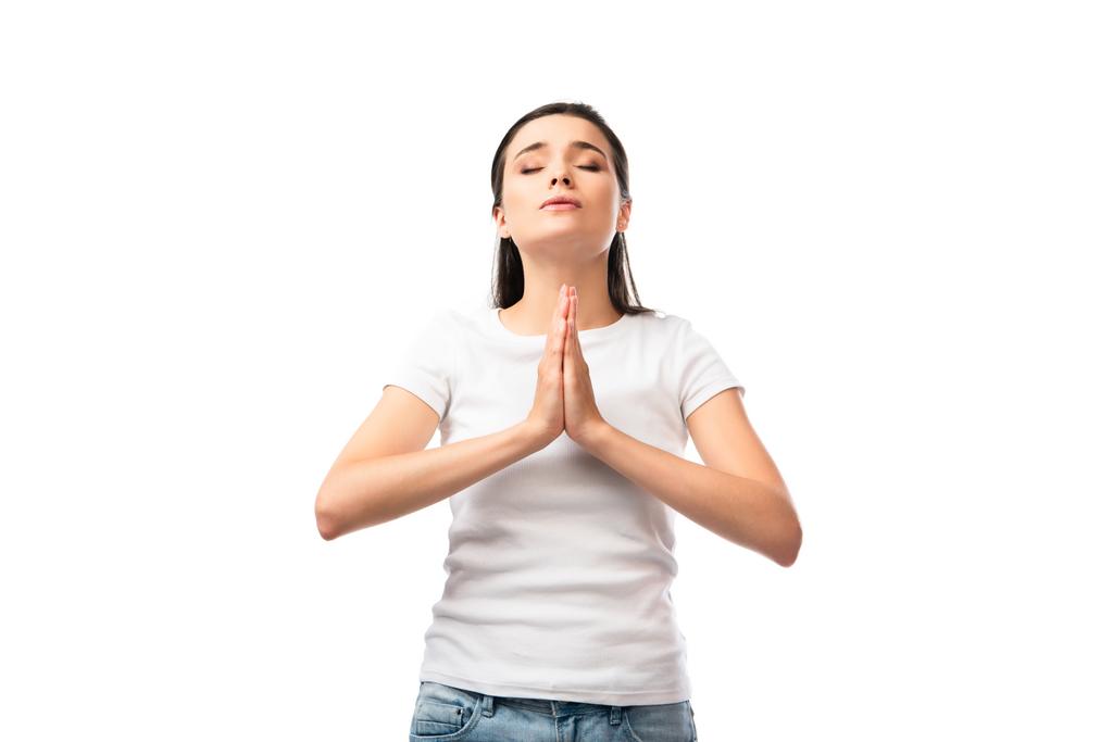 γυναίκα με κλειστά μάτια και τα χέρια προσεύχεται απομονώνονται σε λευκό  - Φωτογραφία, εικόνα