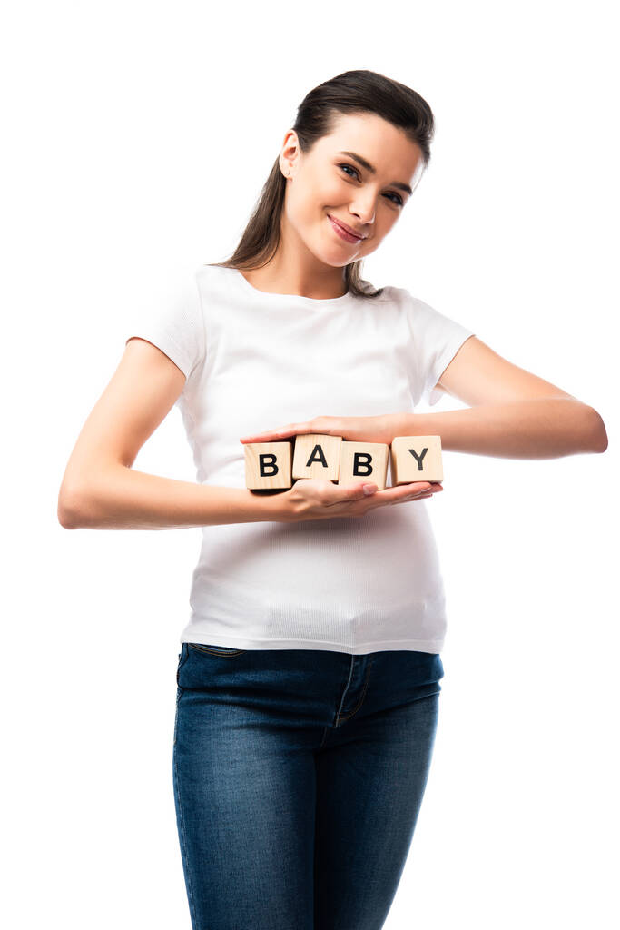 pregnant woman in white t-shirt holding wooden cubes with baby lettering isolated on white  - Photo, Image