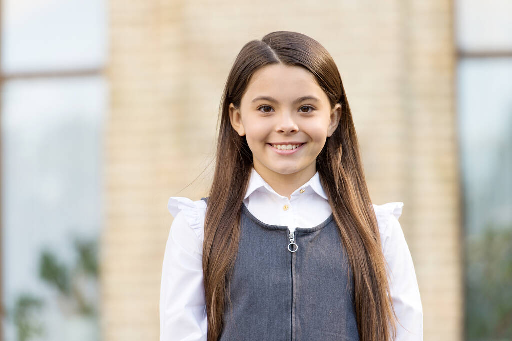 Give big cheer for new school year. Happy schoolgirl outdoors. Little schoolgirl back to school. Small schoolgirl wear uniform. Formal education. Private teaching. September 1. Knowledge day - Photo, Image