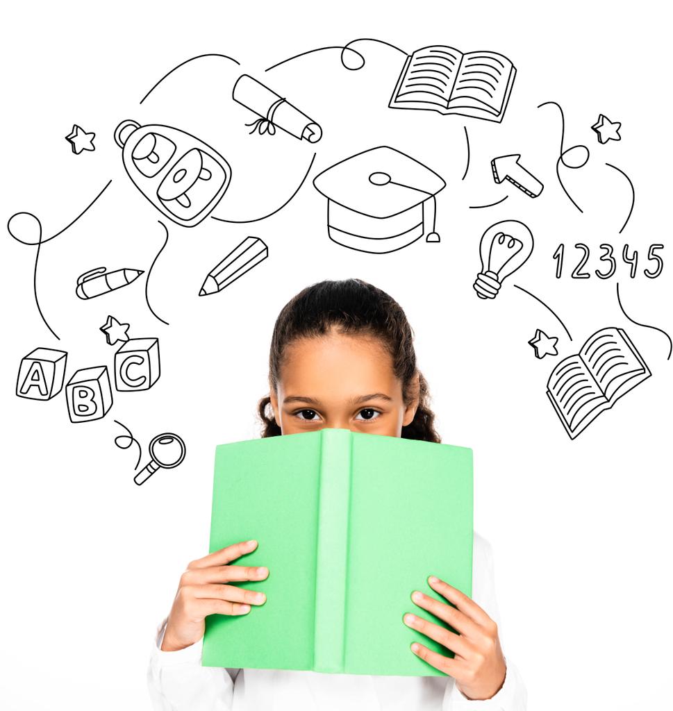 african american schoolgirl looking at camera while holding book near face isolated on white, educational illustration - Photo, Image