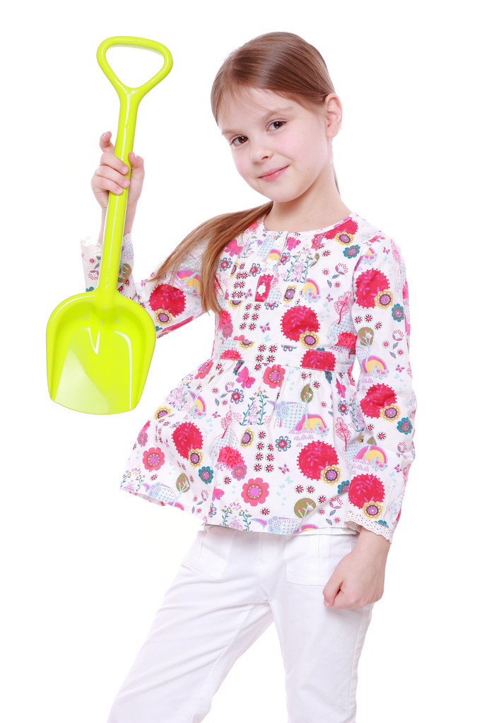 Маленькая девочка с яркой лопатой
 - Фото, изображение
