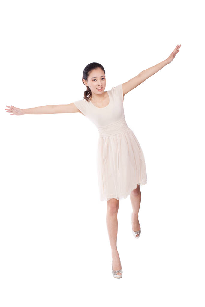 Jeune femme debout avec les bras tendus - Photo, image