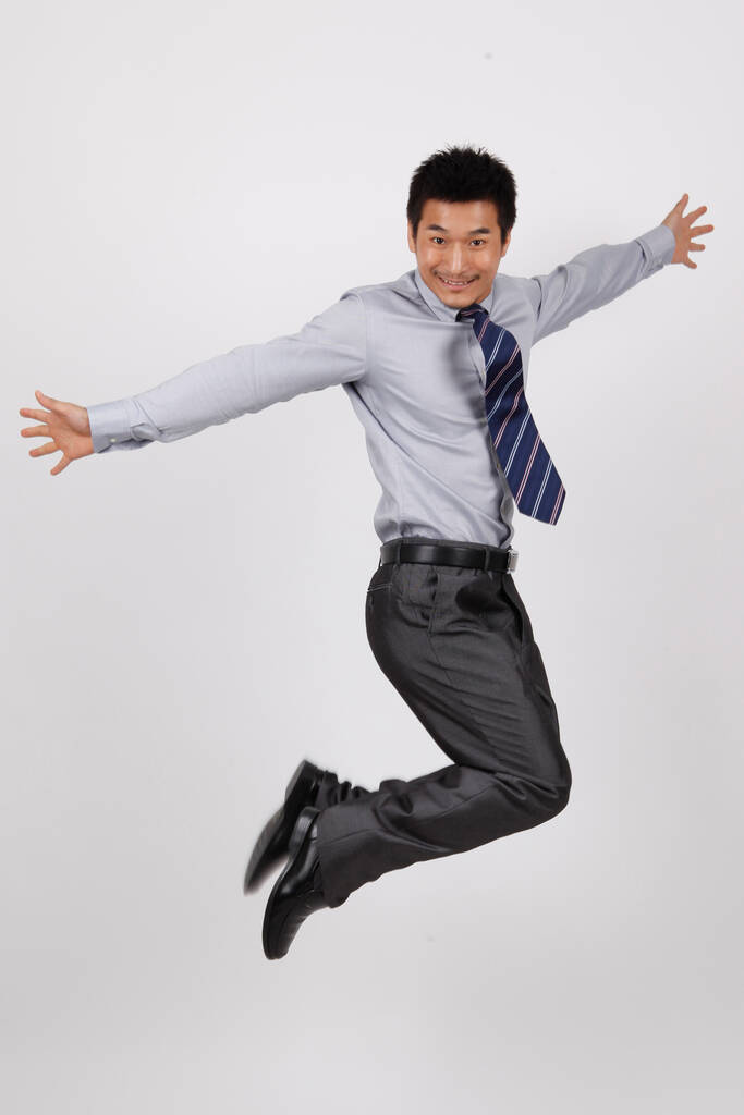 A jumping young business man - Photo, Image