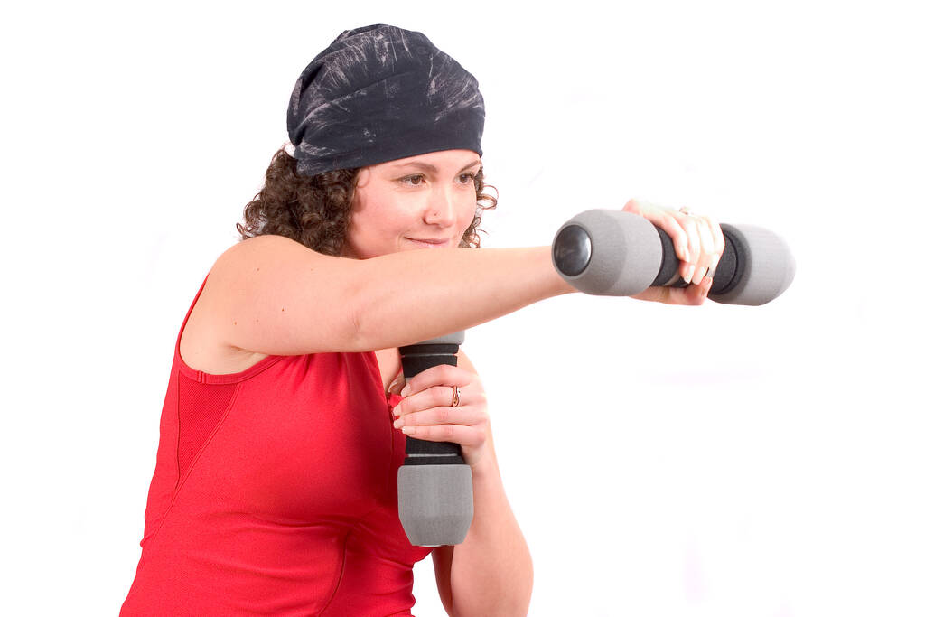 Attraktive Frau macht Übungen mit Gewichten - Foto, Bild