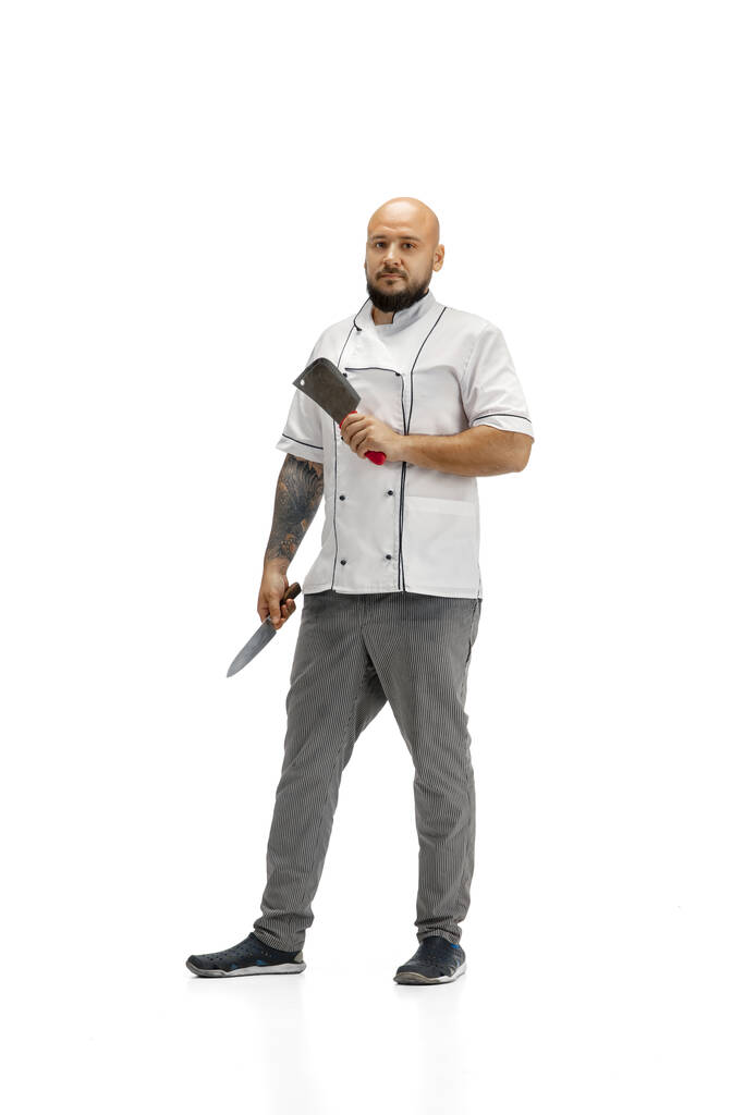 Retrato de um cozinheiro chef masculino, açougueiro isolado em um fundo estúdio branco - Foto, Imagem