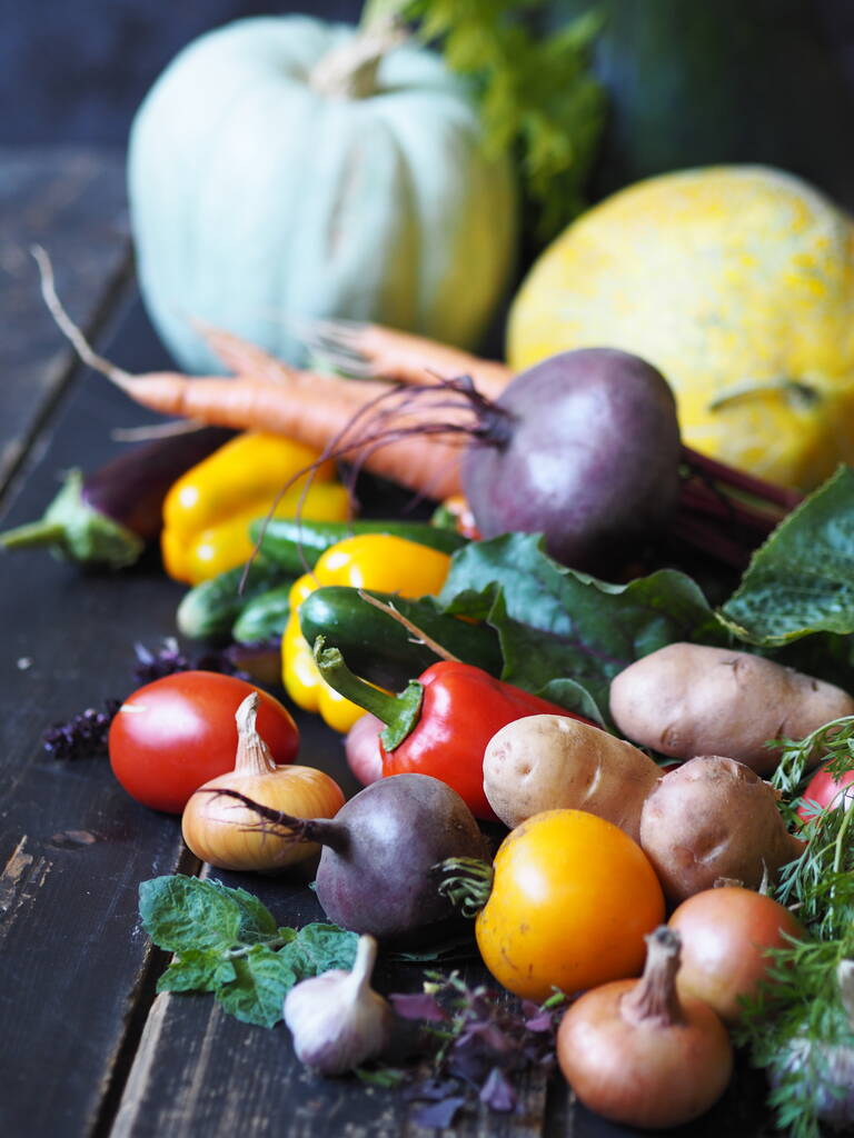 Autumn harvest. Free copy space. Various natural vegetables and fruits, grown in the country, on a dark wooden background. - Photo, Image