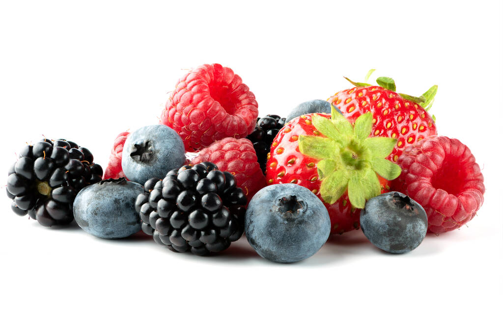 Ripe strawberries, raspberries,  blueberries and blackberries isolated on white background. Full depth of field - Photo, Image