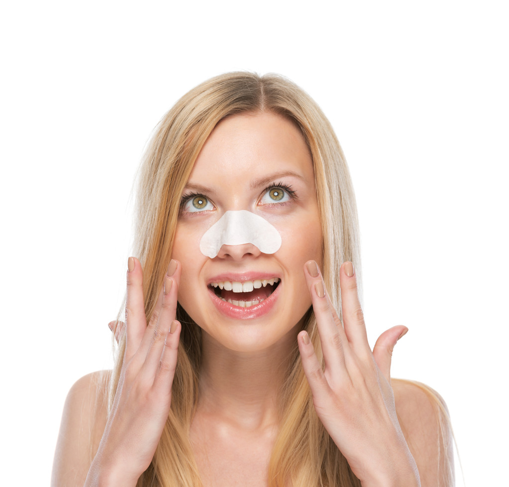 Happy young woman with clear-up strips on nose - Photo, Image