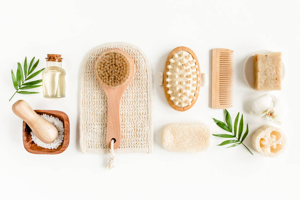 Spa Background. Natural Organic spa cosmetics products, eco friendly bathroom accessories, palm leaves. Skincare concept on white background. Flat lay - Photo, Image