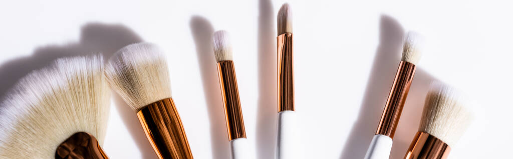 top view of cosmetic brushes set on white background, panoramic shot - Photo, Image