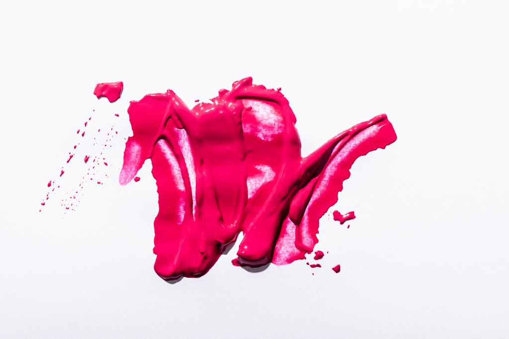 top view of pink lipstick brushstrokes on white background - Photo, Image