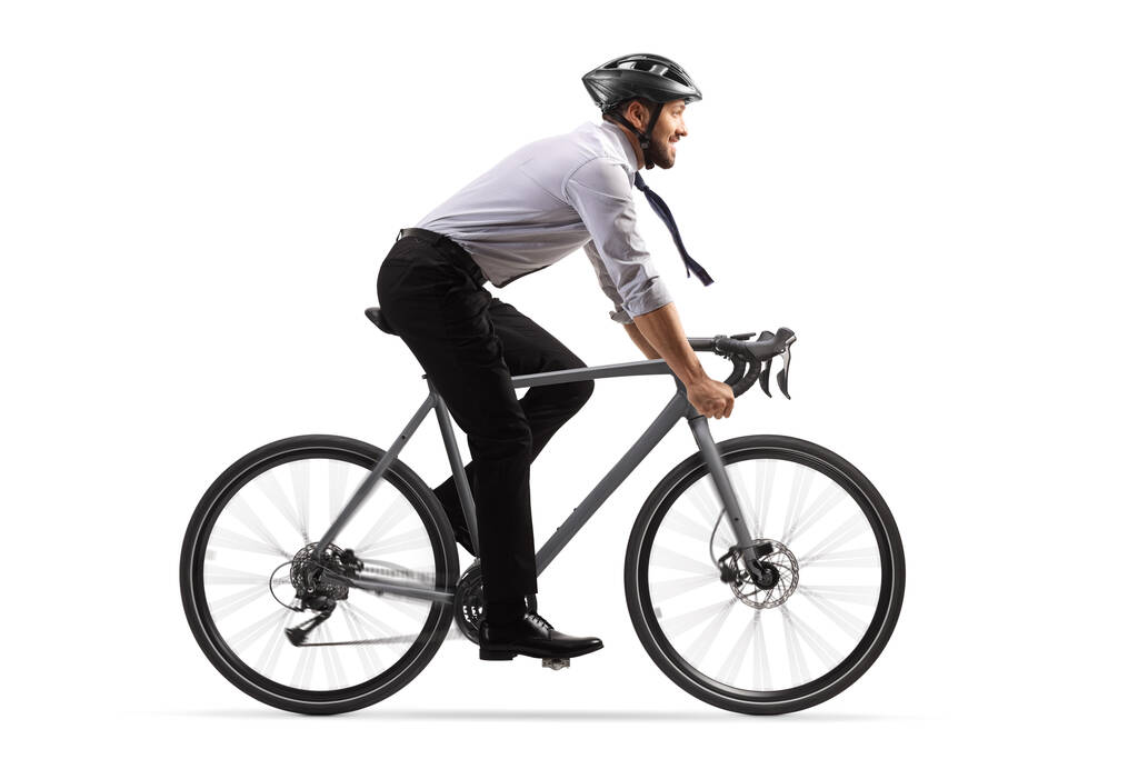 Φωτογραφία προφίλ επιχειρηματία καβάλα σε ποδήλατο με κράνος απομονωμένο σε λευκό φόντο - Φωτογραφία, εικόνα