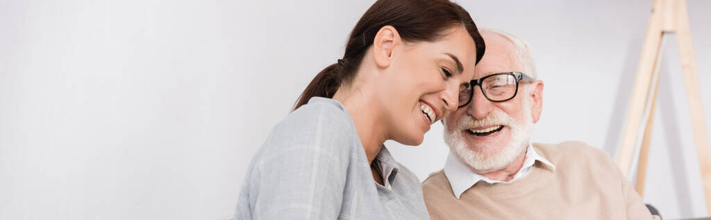 cheerful aged man and adult daughter talking at home, banner - Photo, Image