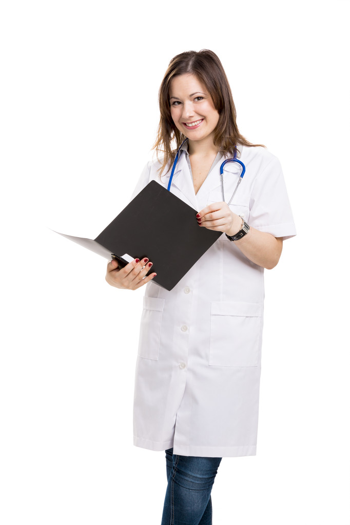 Beautiful young veterinary holding a folder, isolated over white - Photo, Image