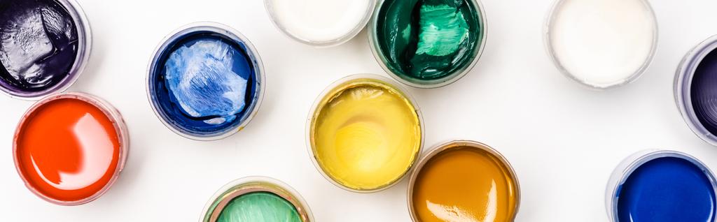 top view of colorful Gouache paints on white background, panoramic shot - Photo, Image