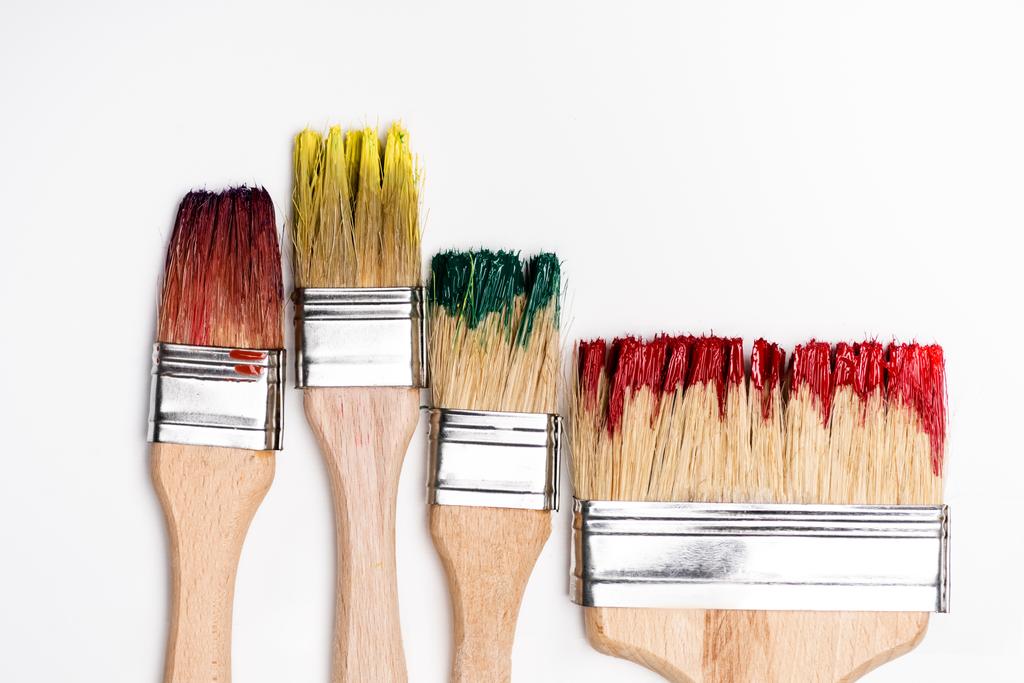 top view of dirty paintbrushes on white background - Photo, Image
