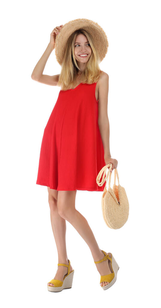 Nuori nainen yllään tyylikäs punainen mekko valkoisella taustalla - Valokuva, kuva