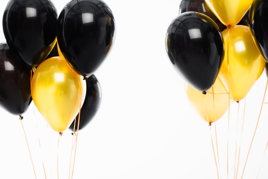 Czarne i złote balony odizolowane na biało  - Zdjęcie, obraz