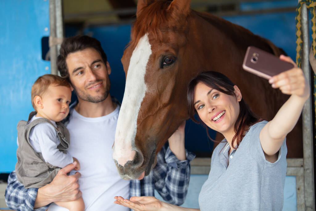 happy family taking a selfie with horse - Photo, Image