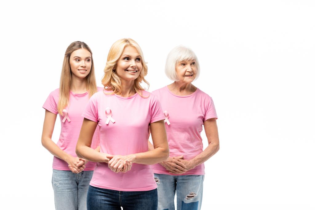 ピンクのTシャツと乳がんの意識のリボンの女性は離れて白で隔離されて見て - 写真・画像