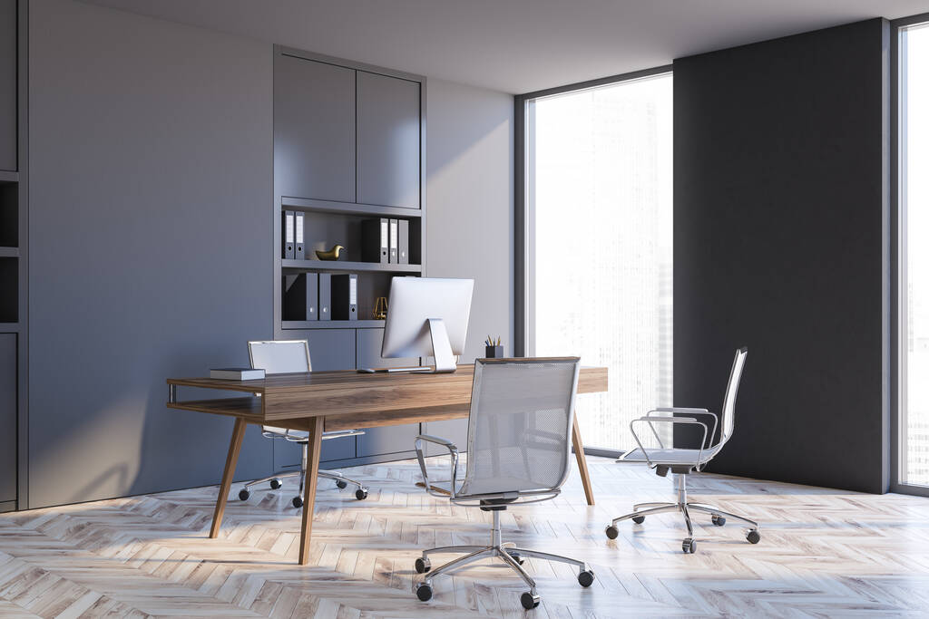 Roh minimalistické kanceláře generálního ředitele s šedými stěnami, dřevěnou podlahou a počítačovým stolem. 3D vykreslování - Fotografie, Obrázek