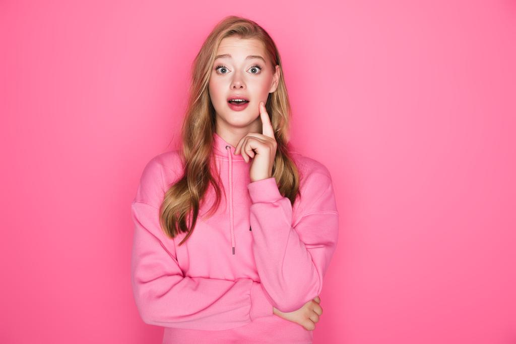 excited beautiful woman with open mouth on pink background - Photo, Image