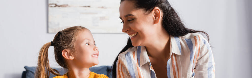 happy mother and daughter looking at each other at home, banner - Photo, Image