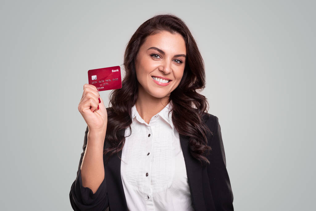 Mature woman showing credit card - Photo, Image