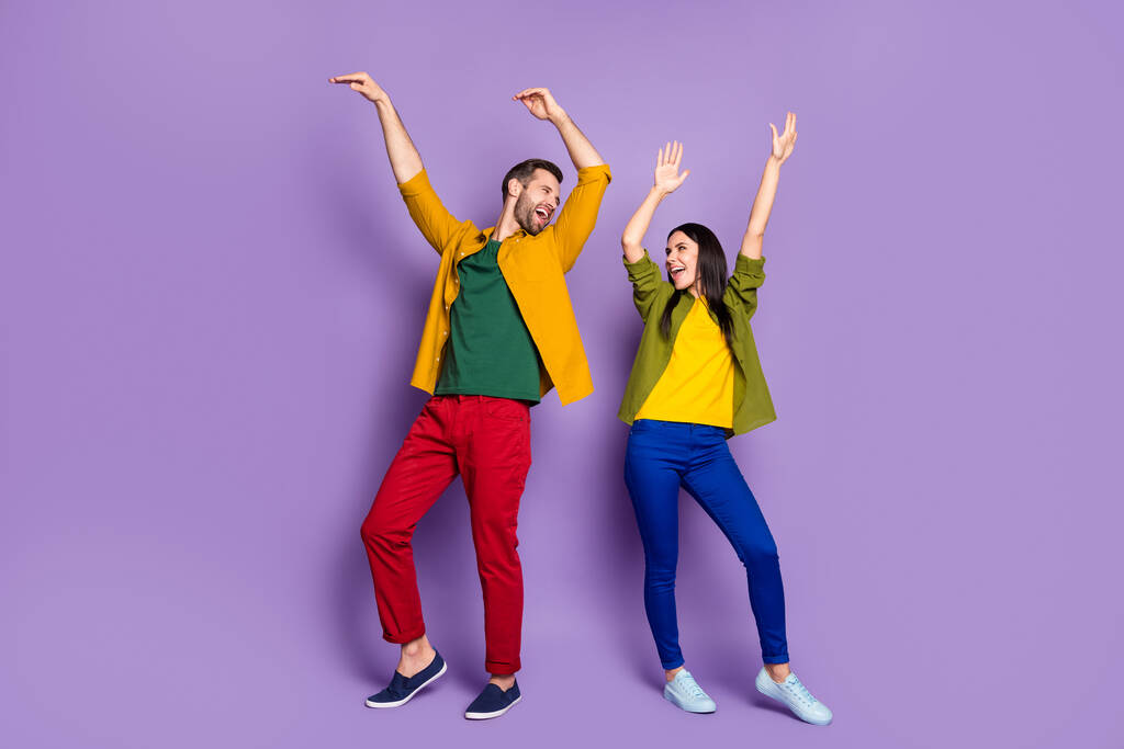 Private party. Full length photo of pretty lady handsome guy chilling home quarantine rejoicing listen music dancing happy together wear shirts pants shoes isolated purple color background - Photo, Image