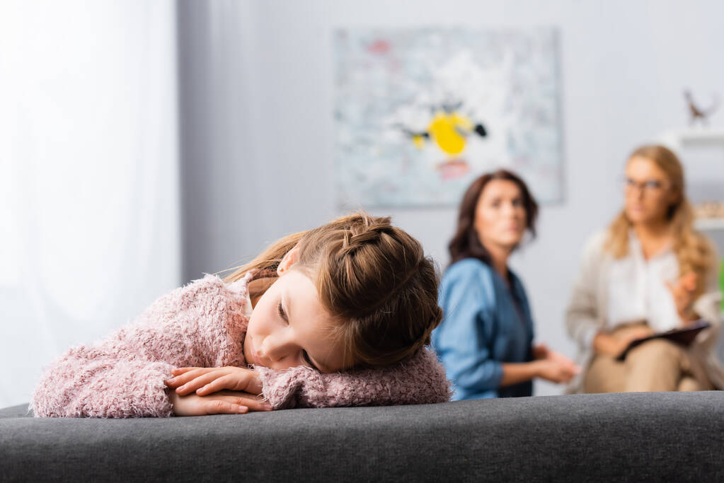 daughter getting bored while mother talking to psychologist - Photo, Image