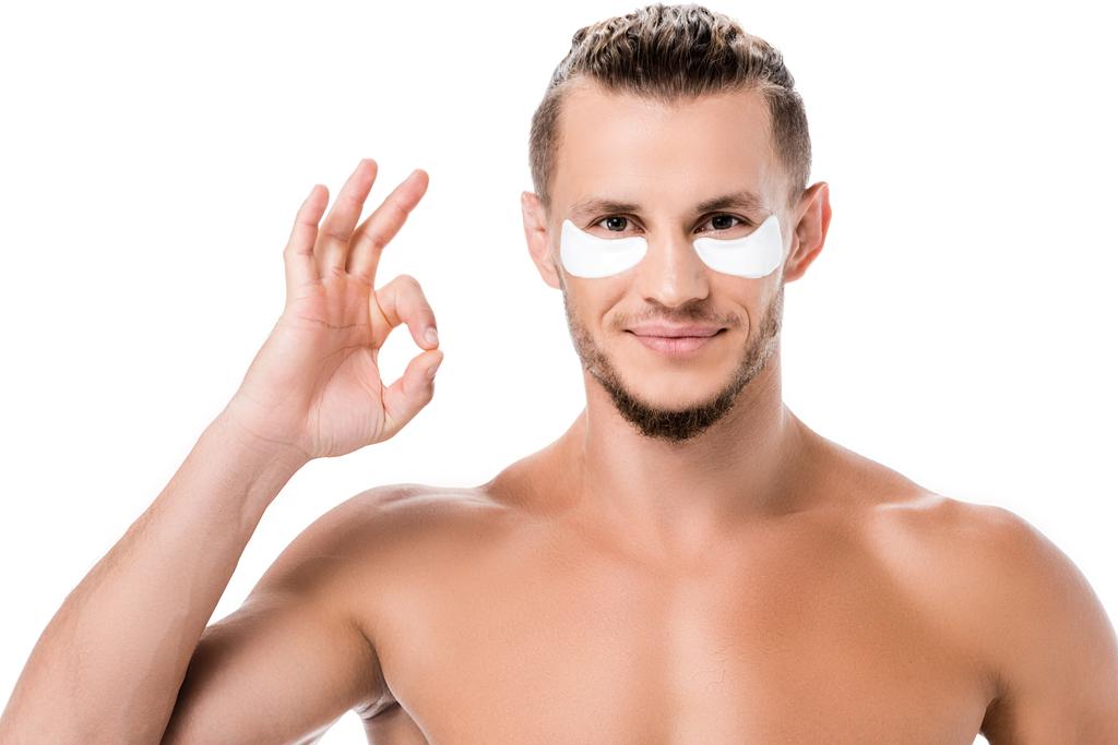 sexy shirtless man eye patches on face showing ok isolated on white - Photo, Image