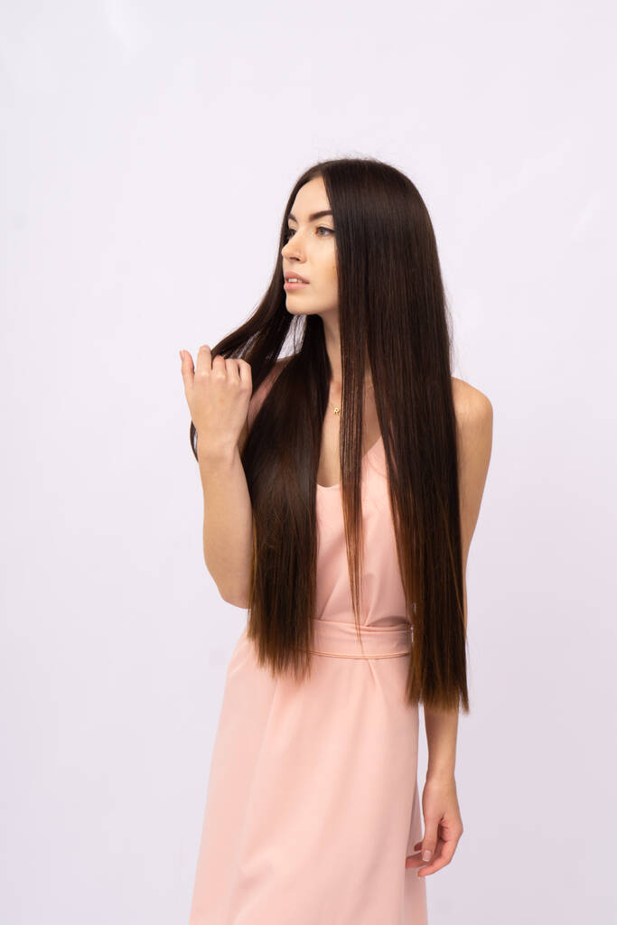 Young woman with long hair. Brunette - Photo, Image