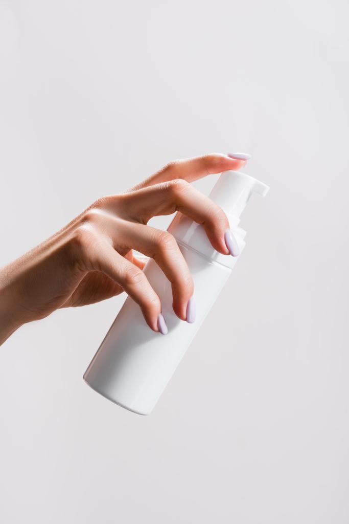 cropped view of woman holding cleansing foam isolated on grey - Photo, Image