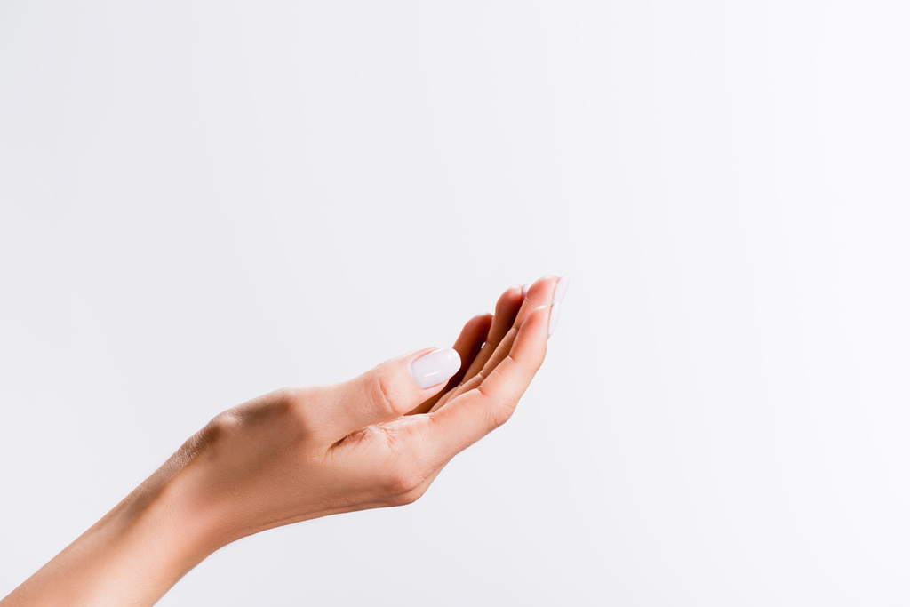 abgeschnittene Ansicht der weiblichen Hand isoliert auf weiß - Foto, Bild